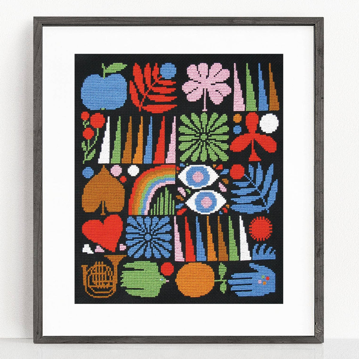 Framed colorful abstract artwork with various patterns and shapes on a white background