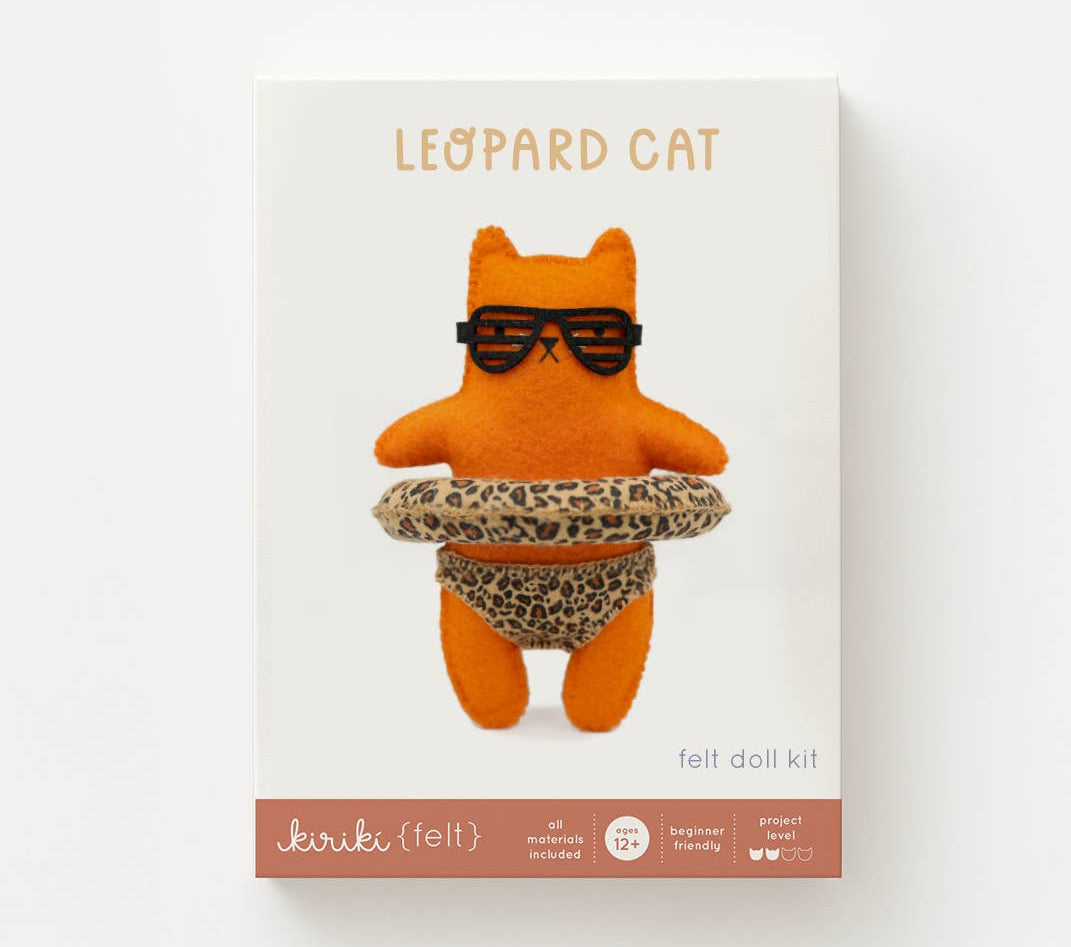 Leopard cat felt doll kit with sunglasses and leopard print skirt on a white background