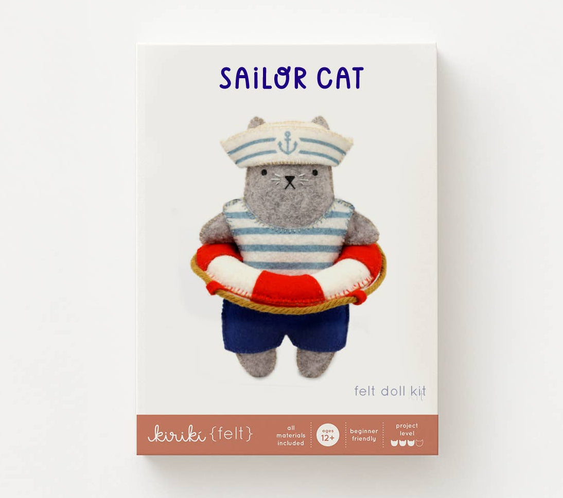 Sailor-themed felt doll kit with a cat design on a white background