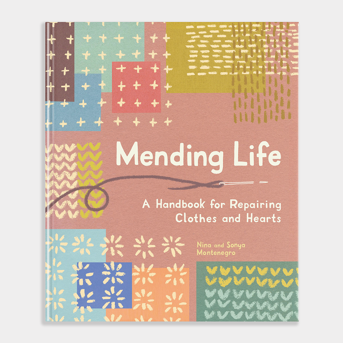 Book titled 'Mending Life' with colorful geometric patterns on a white background