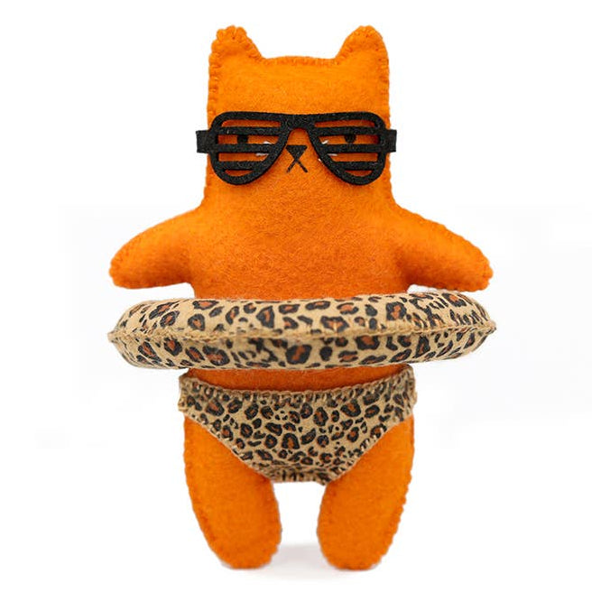 Orange plush toy with sunglasses and leopard print shorts on a white background