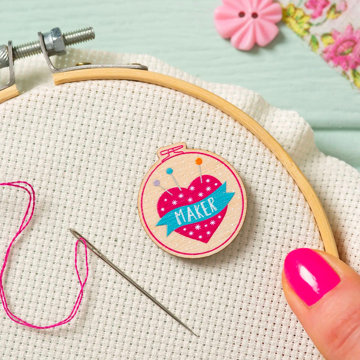 How to use a needle minder for cross stitch and embroidery - Stitched Modern